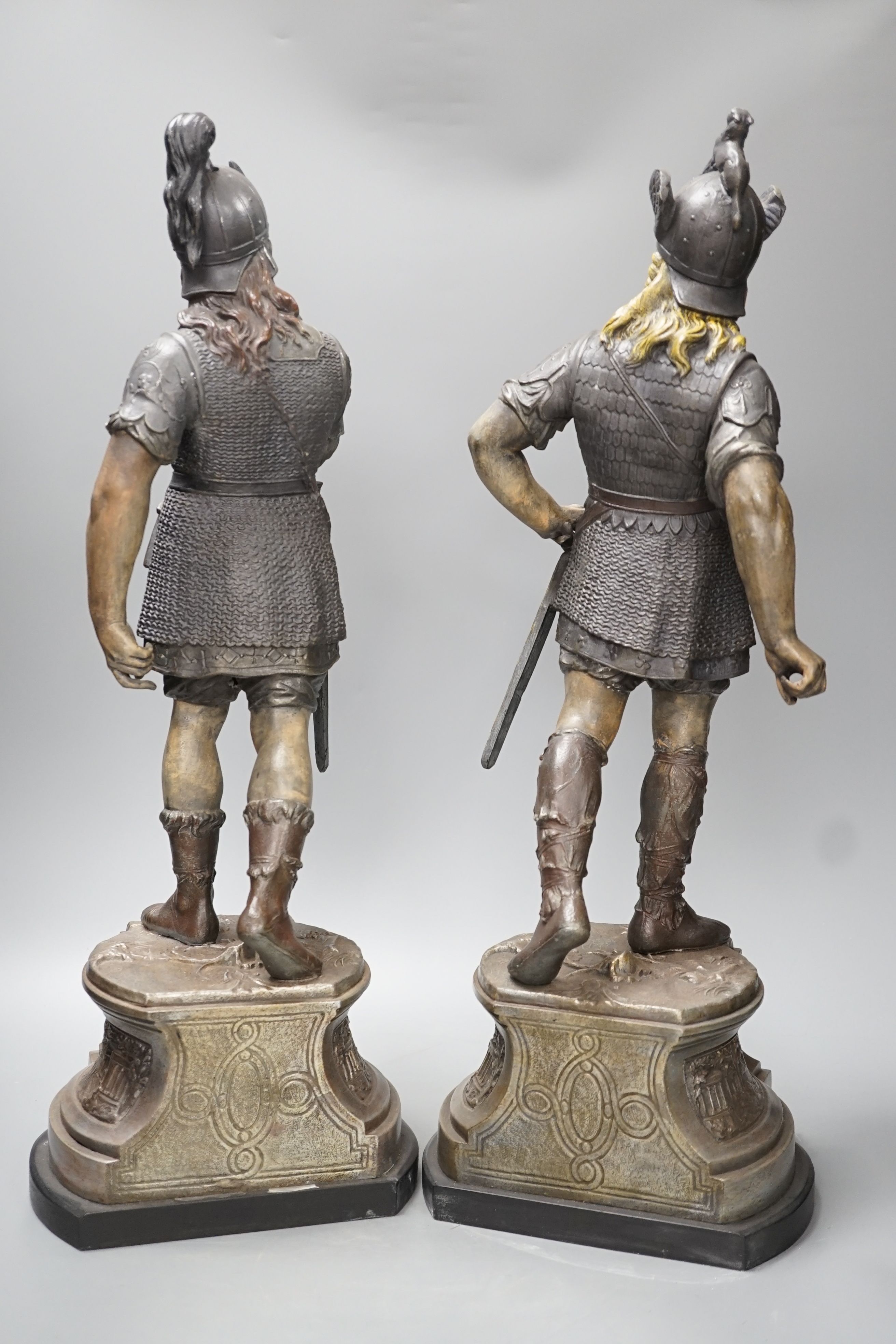 A pair of spelter figures of warriors - 54cm high